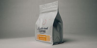 Coffee bean subscription box, packaged coffee bags, delivery service, premium branding, elegant packaging, product photography